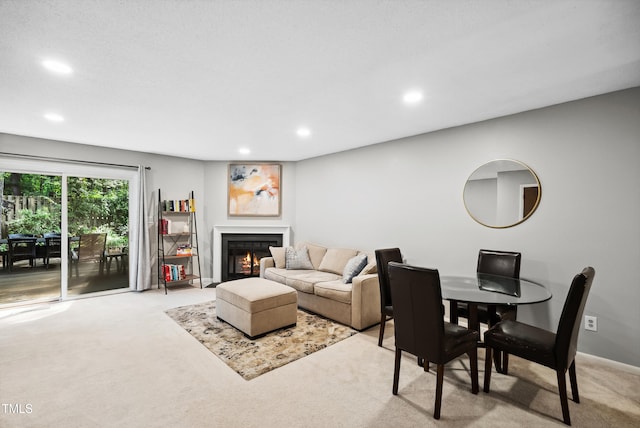 113 Twisted Oak Pl, Durham, NC 27705 - carpeted living room featuring recessed lighting and a lit fireplace