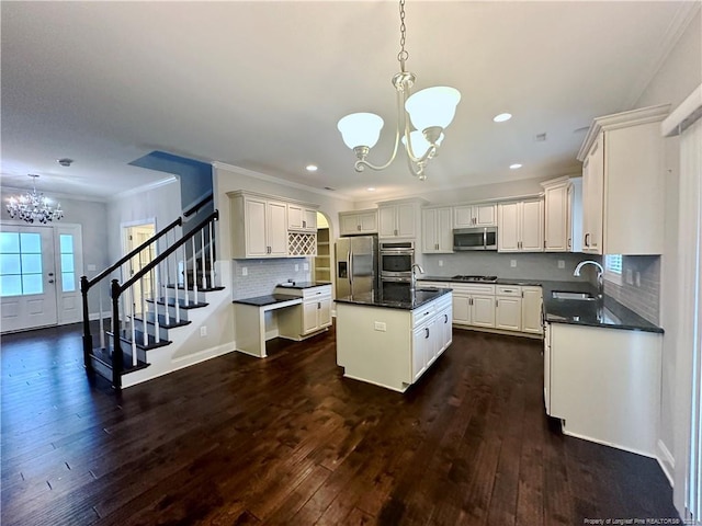 3014 Eaglecrest Ln, Fayetteville, NC 28306 - kitchen featuring a chandelier, stainless steel appliances, a kitchen island with sink, recessed lighting, and dark wood-style floors