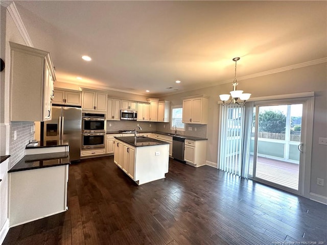 3014 Eaglecrest Ln, Fayetteville, NC 28306 - kitchen with appliances with stainless steel finishes, dark countertops, ornamental molding, a chandelier, and backsplash