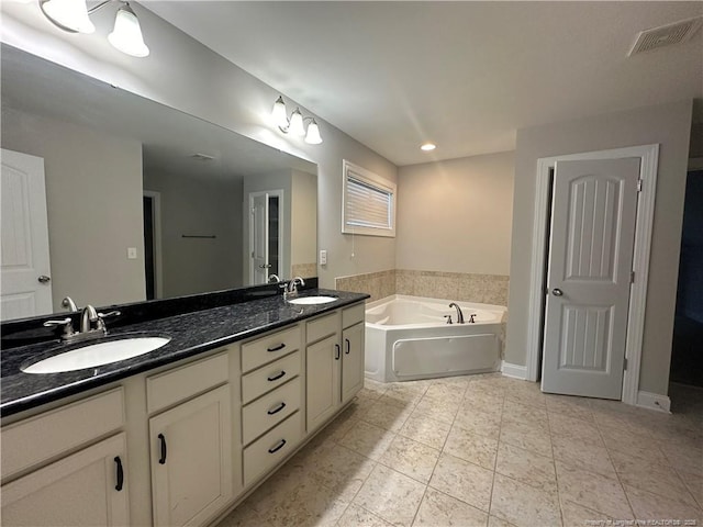 3014 Eaglecrest Ln, Fayetteville, NC 28306 - bathroom with double vanity, a bath, and tile patterned floors