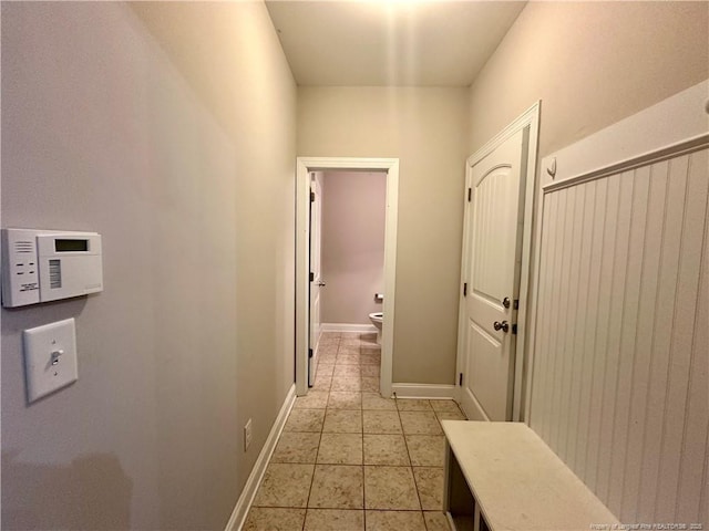 3014 Eaglecrest Ln, Fayetteville, NC 28306 - hallway featuring light tile patterned floors and baseboards