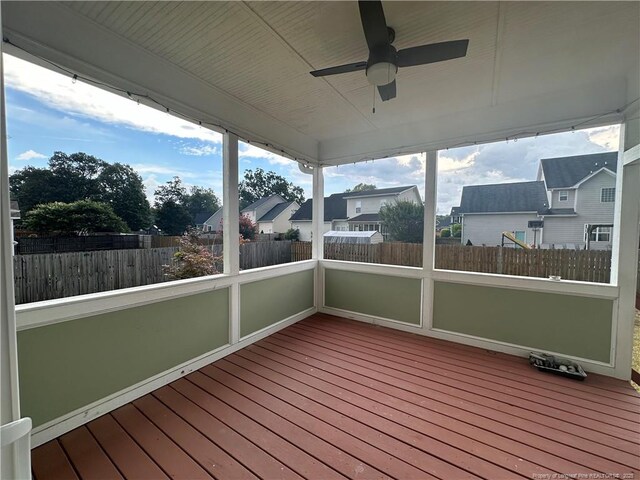3014 Eaglecrest Ln, Fayetteville, NC 28306 - unfurnished sunroom featuring a ceiling fan and a residential view