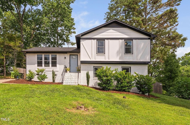 5400 Kaplan Dr, Raleigh, NC 27606 - split level home featuring brick siding and entry steps