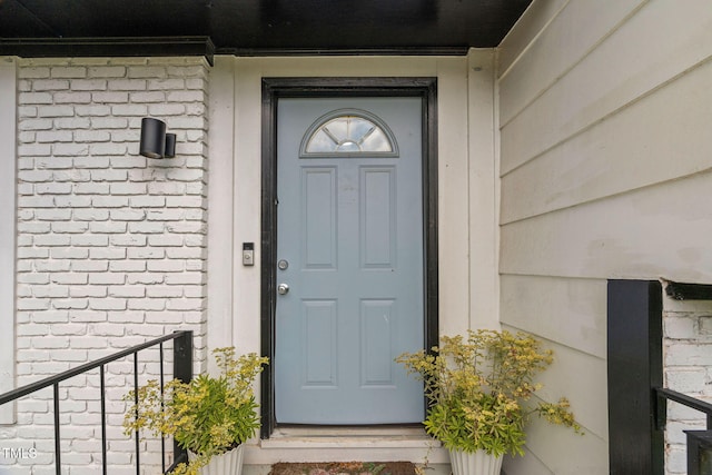 5400 Kaplan Dr, Raleigh, NC 27606 - doorway to property with brick siding