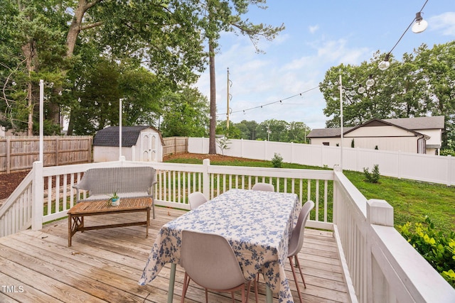 5400 Kaplan Dr, Raleigh, NC 27606 - wooden deck featuring a storage unit, a fenced backyard, and outdoor dining area
