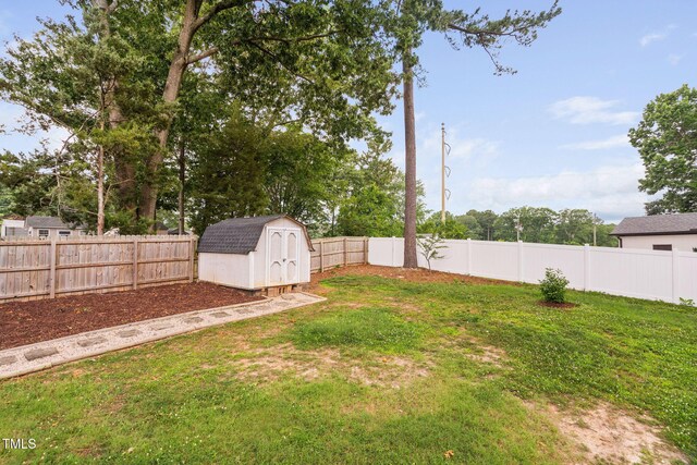 5400 Kaplan Dr, Raleigh, NC 27606 - fenced backyard featuring a storage unit