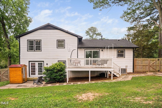 5400 Kaplan Dr, Raleigh, NC 27606 - back of property with french doors, a deck, a fenced backyard, and a gate