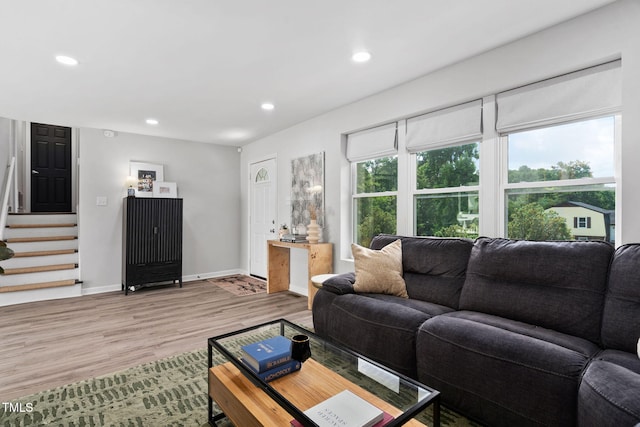 5400 Kaplan Dr, Raleigh, NC 27606 - living area with stairway, light wood-style flooring, and recessed lighting