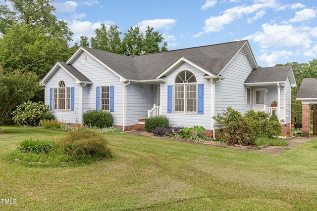 2312 Buckstone Ct, Fuquay Varina, NC 27526 - ranch-style house with roof with shingles and a front yard