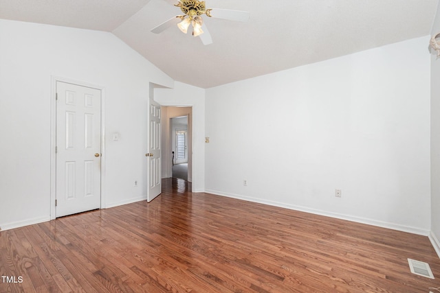 2312 Buckstone Ct, Fuquay Varina, NC 27526 - unfurnished room with a ceiling fan, wood finished floors, and vaulted ceiling
