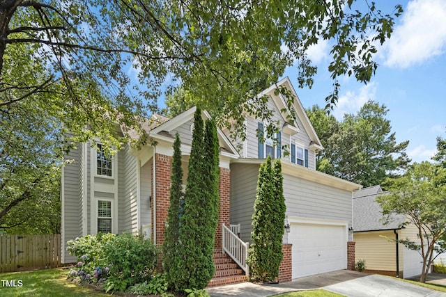 5301 Denmead Way, Raleigh, NC 27613 - view of front of property with brick siding, an attached garage, and driveway