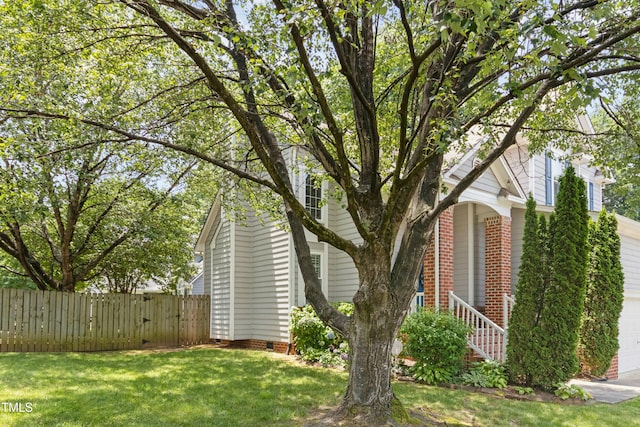 5301 Denmead Way, Raleigh, NC 27613 - view of side of home featuring a garage, brick siding, and crawl space