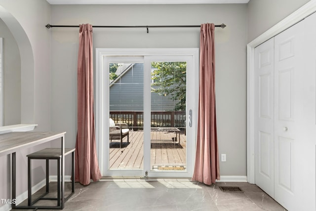 5301 Denmead Way, Raleigh, NC 27613 - doorway to outside with arched walkways and baseboards