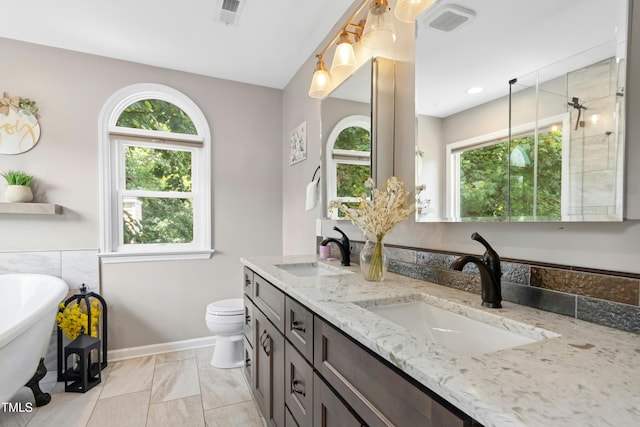5301 Denmead Way, Raleigh, NC 27613 - full bathroom featuring double vanity and a freestanding bath