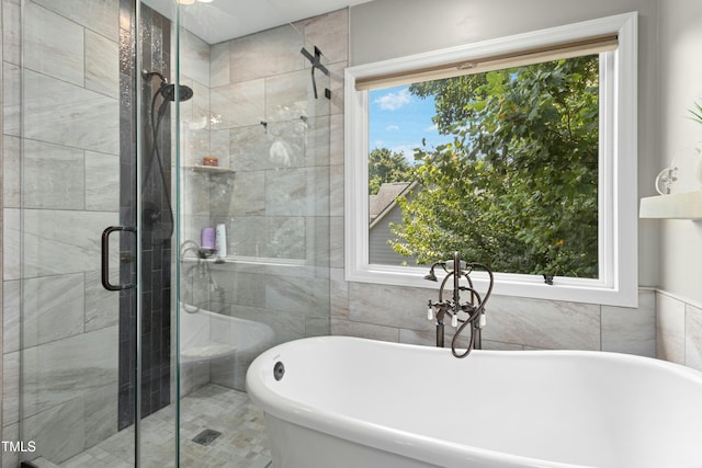 5301 Denmead Way, Raleigh, NC 27613 - full bath with plenty of natural light, a stall shower, and a freestanding tub