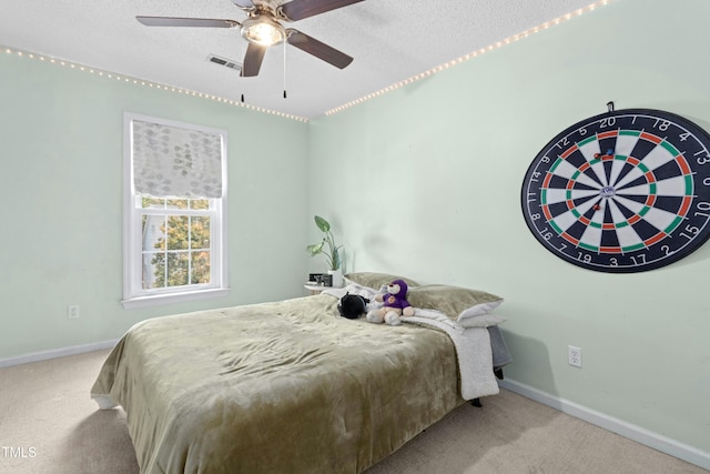 5301 Denmead Way, Raleigh, NC 27613 - carpeted bedroom featuring a textured ceiling and ceiling fan