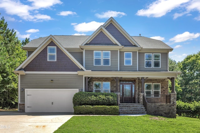 6332 Mountain Oaks Way, Wake Forest, NC 27587 - craftsman-style home with a front yard, driveway, a porch, a garage, and stone siding