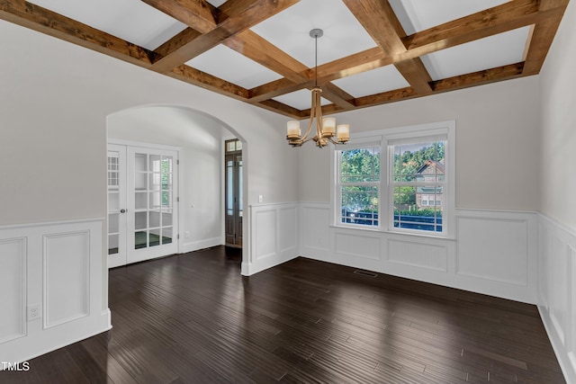 6332 Mountain Oaks Way, Wake Forest, NC 27587 - empty room featuring arched walkways, coffered ceiling, healthy amount of natural light, beam ceiling, and wainscoting