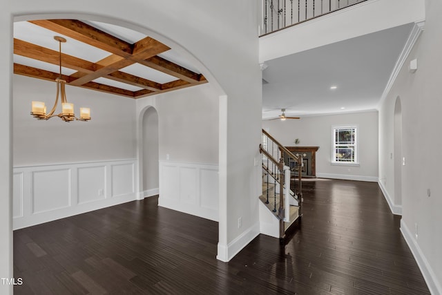 6332 Mountain Oaks Way, Wake Forest, NC 27587 - unfurnished room with arched walkways, beam ceiling, a ceiling fan, wood finished floors, and wainscoting