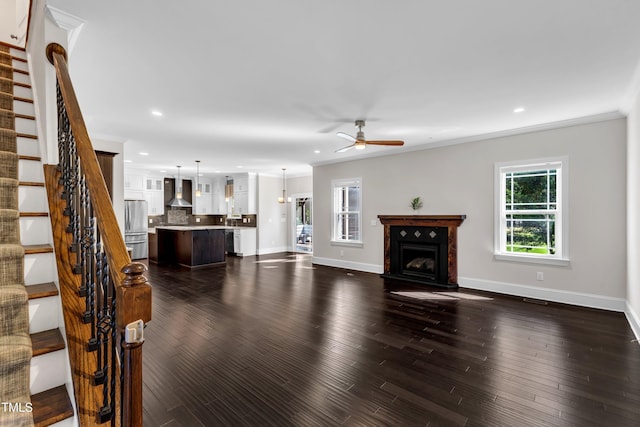 6332 Mountain Oaks Way, Wake Forest, NC 27587 - living room with a ceiling fan, healthy amount of natural light, stairs, ornamental molding, and a fireplace