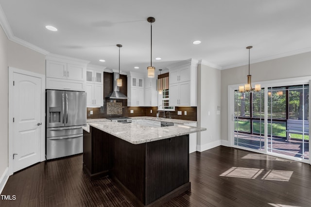 6332 Mountain Oaks Way, Wake Forest, NC 27587 - kitchen featuring stainless steel appliances, wall chimney exhaust hood, tasteful backsplash, glass insert cabinets, and light stone countertops