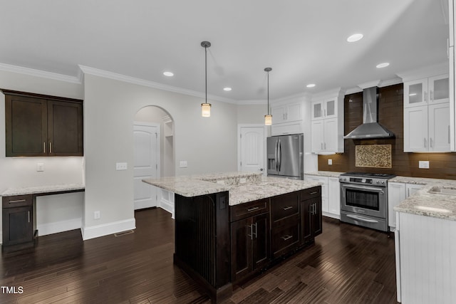 6332 Mountain Oaks Way, Wake Forest, NC 27587 - kitchen featuring appliances with stainless steel finishes, wall chimney exhaust hood, dark wood finished floors, tasteful backsplash, and glass insert cabinets
