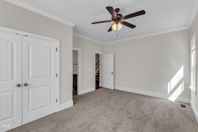 6332 Mountain Oaks Way, Wake Forest, NC 27587 - unfurnished bedroom with carpet, crown molding, a closet, and ceiling fan