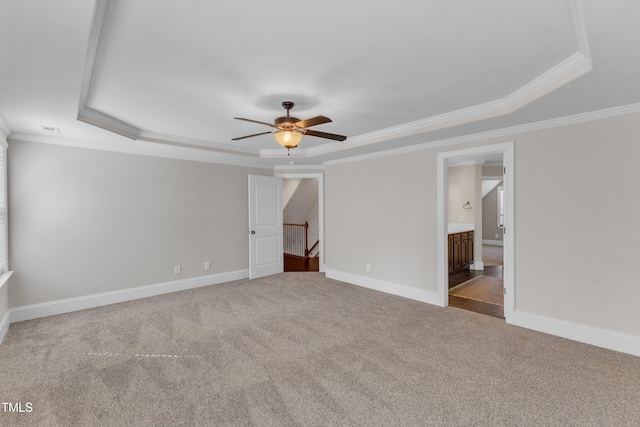 6332 Mountain Oaks Way, Wake Forest, NC 27587 - unfurnished bedroom featuring a raised ceiling, ornamental molding, carpet flooring, ensuite bathroom, and a ceiling fan
