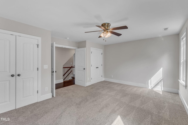 6332 Mountain Oaks Way, Wake Forest, NC 27587 - unfurnished bedroom with carpet flooring, two closets, and ceiling fan