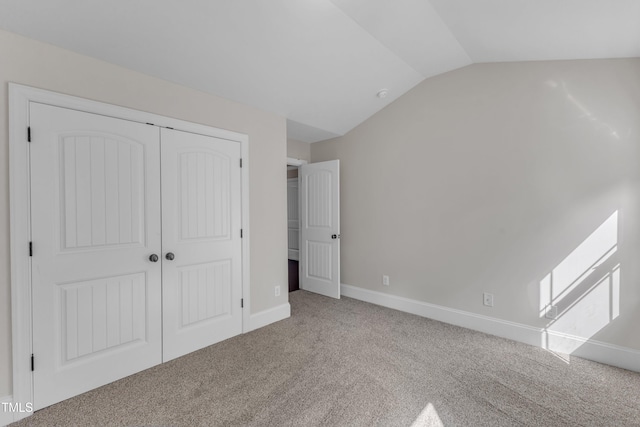 6332 Mountain Oaks Way, Wake Forest, NC 27587 - unfurnished bedroom featuring carpet flooring, vaulted ceiling, and a closet