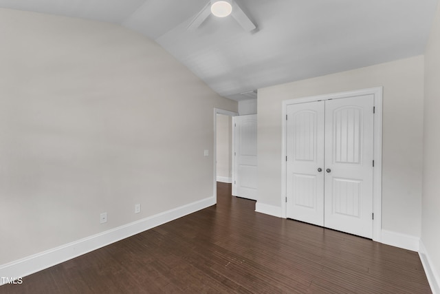 6332 Mountain Oaks Way, Wake Forest, NC 27587 - unfurnished bedroom with dark wood-type flooring, a closet, lofted ceiling, and ceiling fan