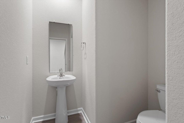 94 Taverners Ln, Angier, NC 27501 - bathroom featuring toilet and wood finished floors