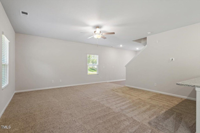 94 Taverners Ln, Angier, NC 27501 - unfurnished living room featuring a ceiling fan and light carpet