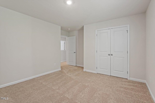 94 Taverners Ln, Angier, NC 27501 - unfurnished bedroom featuring light colored carpet and a closet