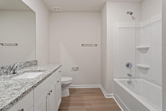 94 Taverners Ln, Angier, NC 27501 - full bath featuring wood finished floors, vanity, and shower / tub combination