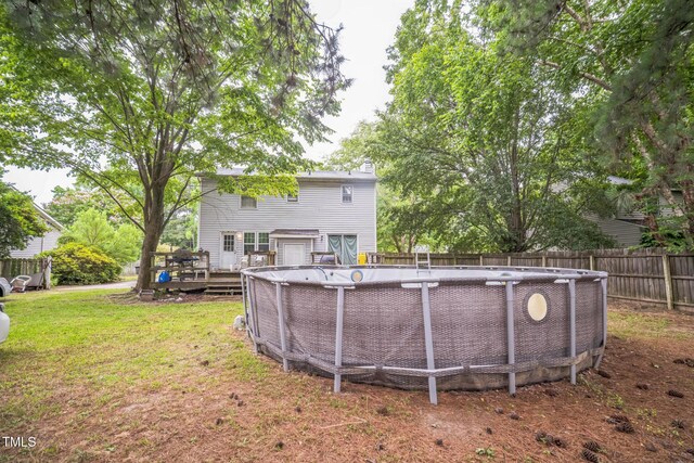2504 Lancaster Rd NW, Wilson, NC 27896 - back of house with a wooden deck and a fenced backyard