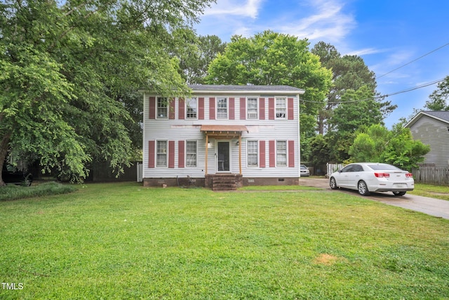 2504 Lancaster Rd NW, Wilson, NC 27896 - colonial-style house with crawl space, a front lawn, and concrete driveway