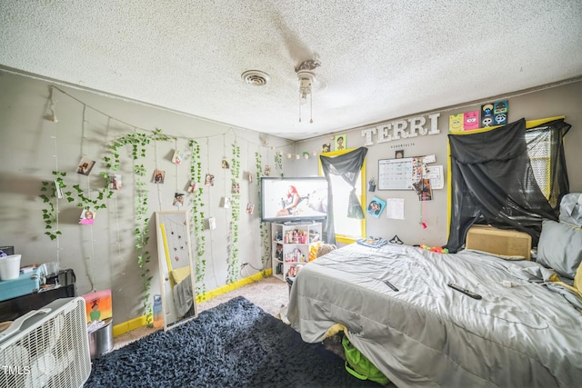 2504 Lancaster Rd NW, Wilson, NC 27896 - bedroom with a textured ceiling and ceiling fan
