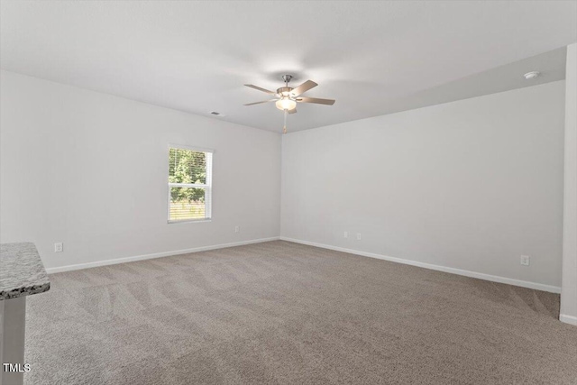 154 Taverners Ln, Angier, NC 27501 - empty room with ceiling fan and carpet flooring