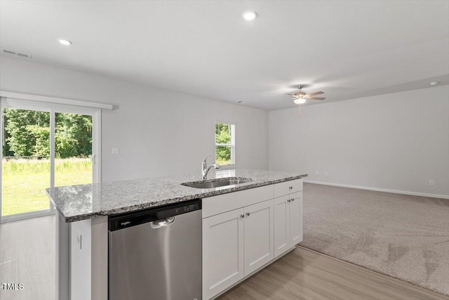 154 Taverners Ln, Angier, NC 27501 - kitchen featuring dishwasher, a ceiling fan, white cabinetry, light stone counters, and a center island with sink