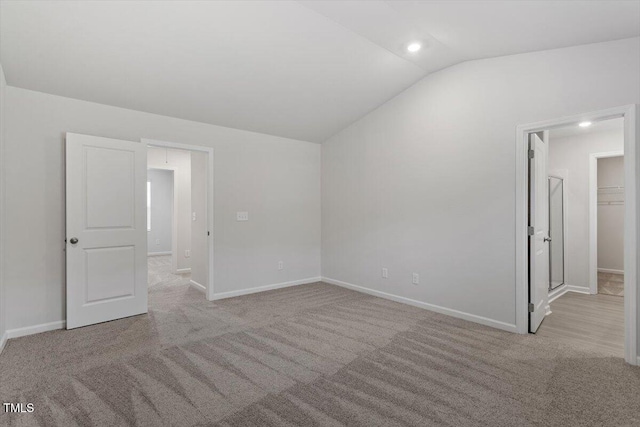 154 Taverners Ln, Angier, NC 27501 - carpeted empty room featuring lofted ceiling and baseboards