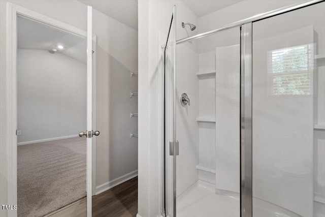 154 Taverners Ln, Angier, NC 27501 - bathroom with a stall shower and wood finished floors