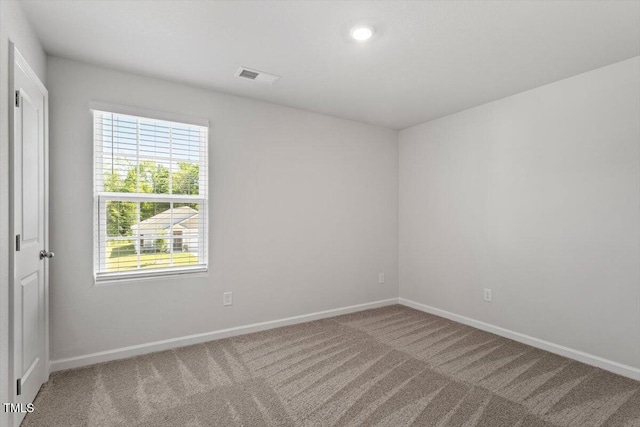154 Taverners Ln, Angier, NC 27501 - spare room featuring carpet and recessed lighting