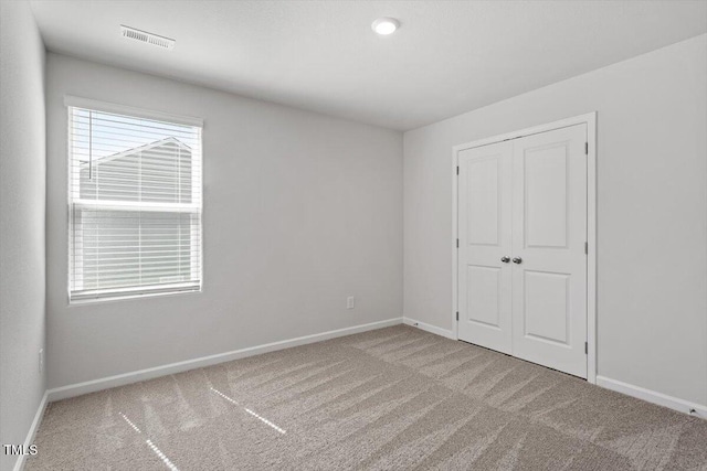 154 Taverners Ln, Angier, NC 27501 - unfurnished bedroom featuring carpet floors and a closet