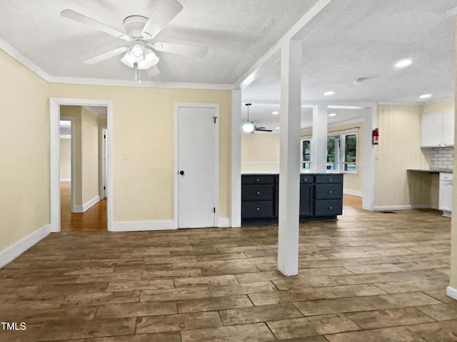 3205 Marita Dr, Fayetteville, NC 28301 - unfurnished living room with ceiling fan, dark wood finished floors, ornamental molding, recessed lighting, and a textured ceiling