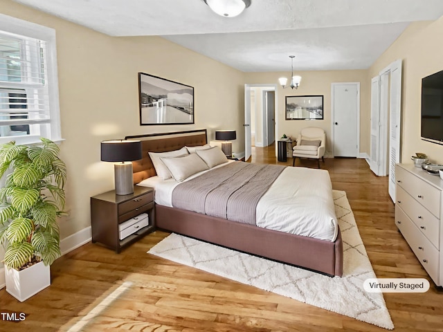 3205 Marita Dr, Fayetteville, NC 28301 - bedroom with a chandelier and wood finished floors