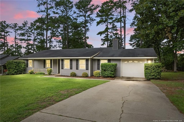 3511 Rolls Ave, Fayetteville, NC 28311 - ranch-style house with a garage, concrete driveway, a chimney, a front yard, and covered porch