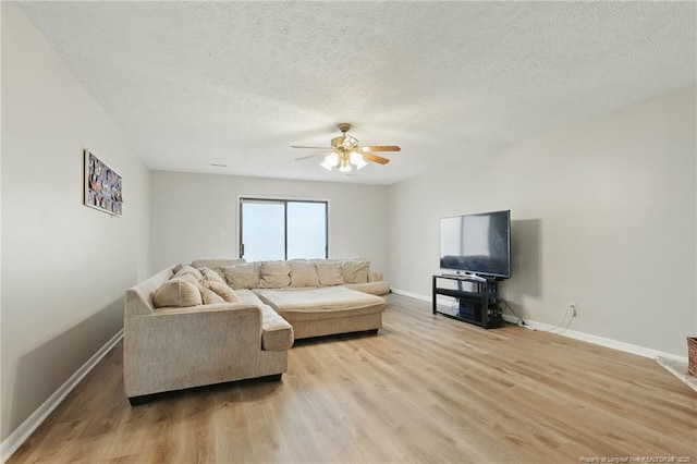 3511 Rolls Ave, Fayetteville, NC 28311 - living room featuring ceiling fan, light wood-style floors, and a textured ceiling