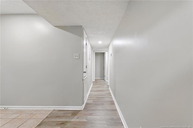 3511 Rolls Ave, Fayetteville, NC 28311 - hallway featuring a textured ceiling, light wood finished floors, and recessed lighting