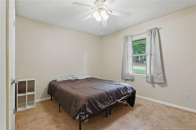 3511 Rolls Ave, Fayetteville, NC 28311 - bedroom with carpet flooring, a textured ceiling, and ceiling fan
